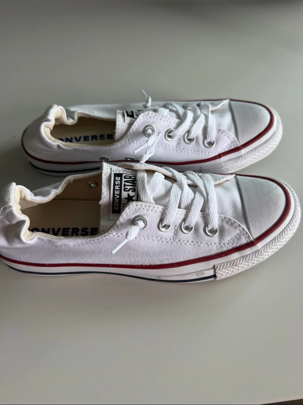 Converse White Low Top Sneakers with Red Trim